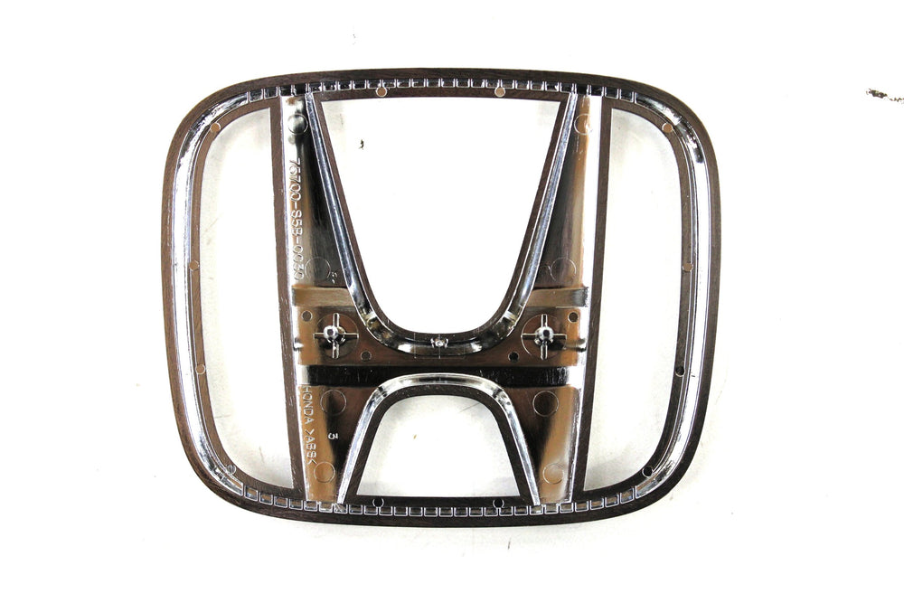 Honda grille emblem 75700-S5B-003 packaged shows genuine part ready for install