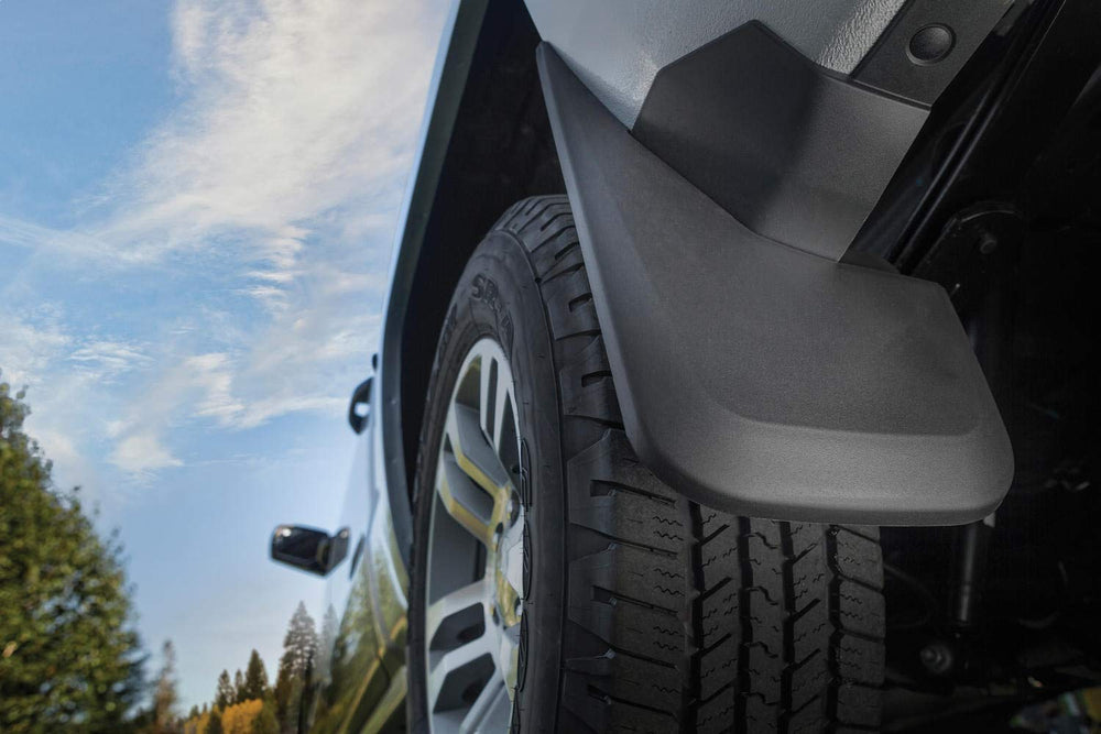 Husky Liners logo on black mud guard for Silverado.
