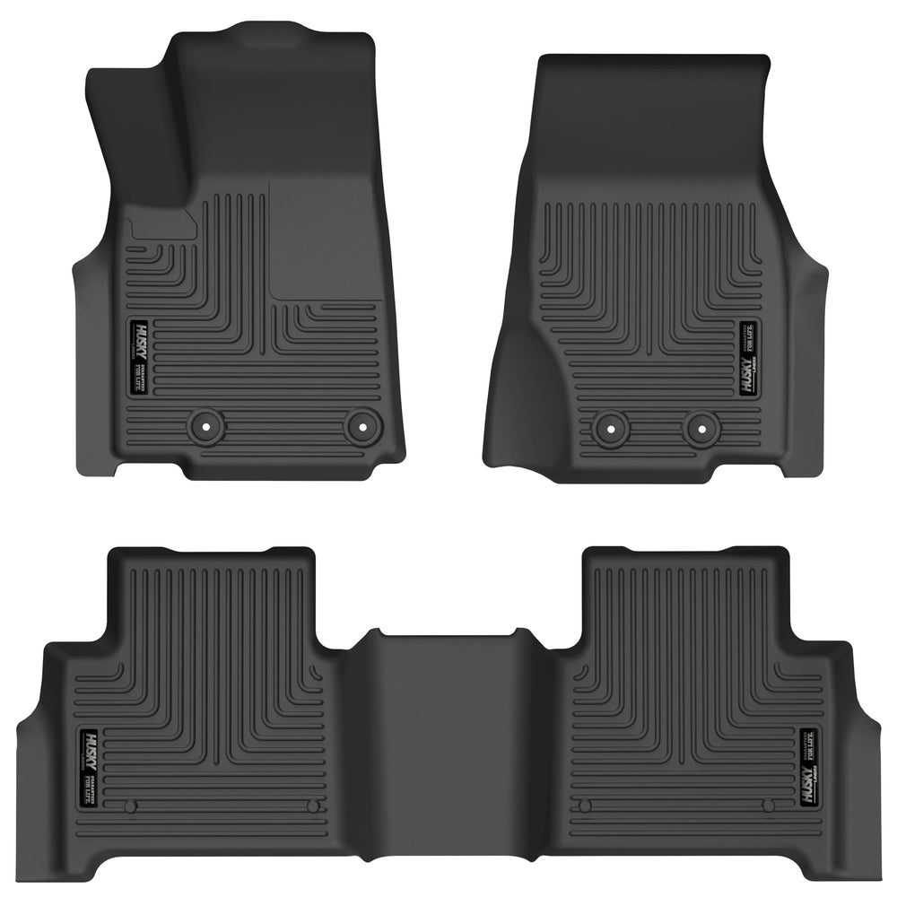 Husky Liners WeatherBeater front-row mats on a Jeep Grand Cherokee showing edge-to-edge protection
