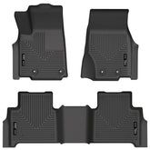 Husky Liners WeatherBeater front-row mats on a Jeep Grand Cherokee showing edge-to-edge protection