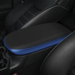 INTGET RAV4 console cover in black with blue stitching complements interior.