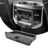 JLQP rear seat storage tray with cubby keeping cables organized in the Dodge Ram interior