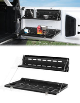 JROAD Bronco tailgate table folded into MOLLE panel for compact storage