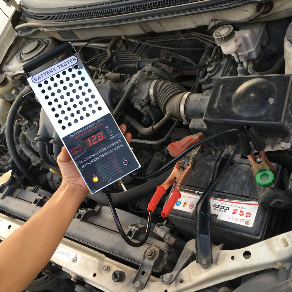 Kaiheng load tester in use on a 12V battery for diagnostics