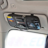 Kartisen sun visor organizer with large zipped compartment for essentials.