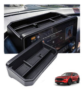 Katorn dashboard storage tray behind the CX-5 screen fits perfectly.