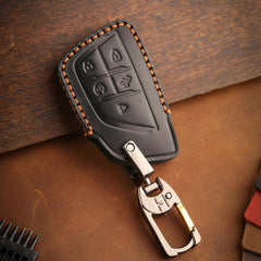 KEAIKE black leather key fob cover on truck keys for everyday use.