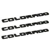KINGBOO Colorado fender badge in gloss black 3D emblem for durable truck styling.