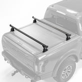 KOKSHELY 65-4 inch cross bars installed on a mid-size truck for versatile hauling.