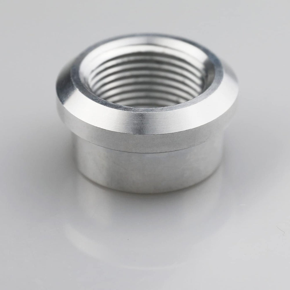 KRD PERFORMANCE close-up of 1-inch NPT female weld-on bung showing precise threads for tight seals.