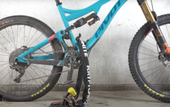 Kryptonite Evolution Ground Anchor in-use demonstrates secure attachment for bikes and e-bikes.