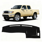 KUST Toyota Tacoma dash cover for left-driver view reduces glare and protects the dashboard.