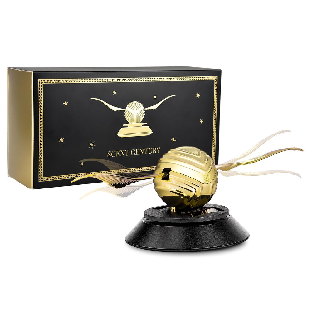 Kwak's solar car air freshener with wings fluttering on the dashboard under sunlight.