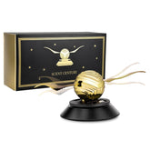 Kwak's solar car air freshener with wings fluttering on the dashboard under sunlight.