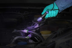 LeakFinder caulk gun injector for even dye distribution in vehicle leaks.