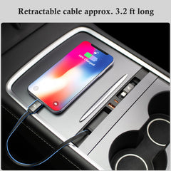 Compact center-console dock showing integrated charging station within reach.