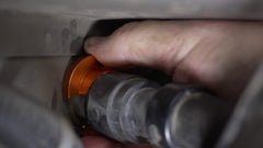 Lisle 39190 tool shown slipping over heater hose in tight space.