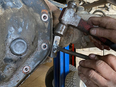Lisle 50210 gasket separator in use to separate a pan from a gasket