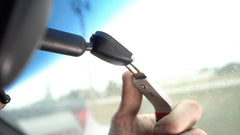 Lisle 83050 mirror disconnect action tool facilitates safe removal.