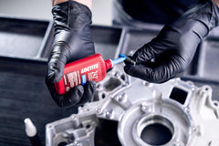 Cured Loctite 242 on engine bolts showing secure hold
