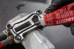 Loctite 515 in-service flange sealing that flexes with moving parts.