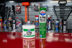 Lucas Oil X-Tra Heavy Duty Grease label closeup shows reliability and OEM-exceeding performance promise.