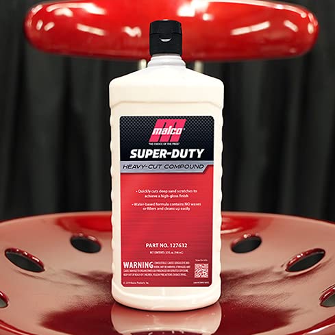 Applying Malco compound with a polisher for professional detailing results.