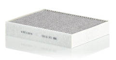 Activated carbon layer closeup highlighting gas and odor capture for fresher cabin air.