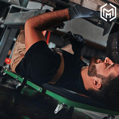 M-AUTO creeper bed with thick padding for comfort during repairs.