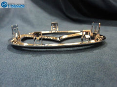 Mazda C235-51-731A badge, high-quality materials with durable finish.