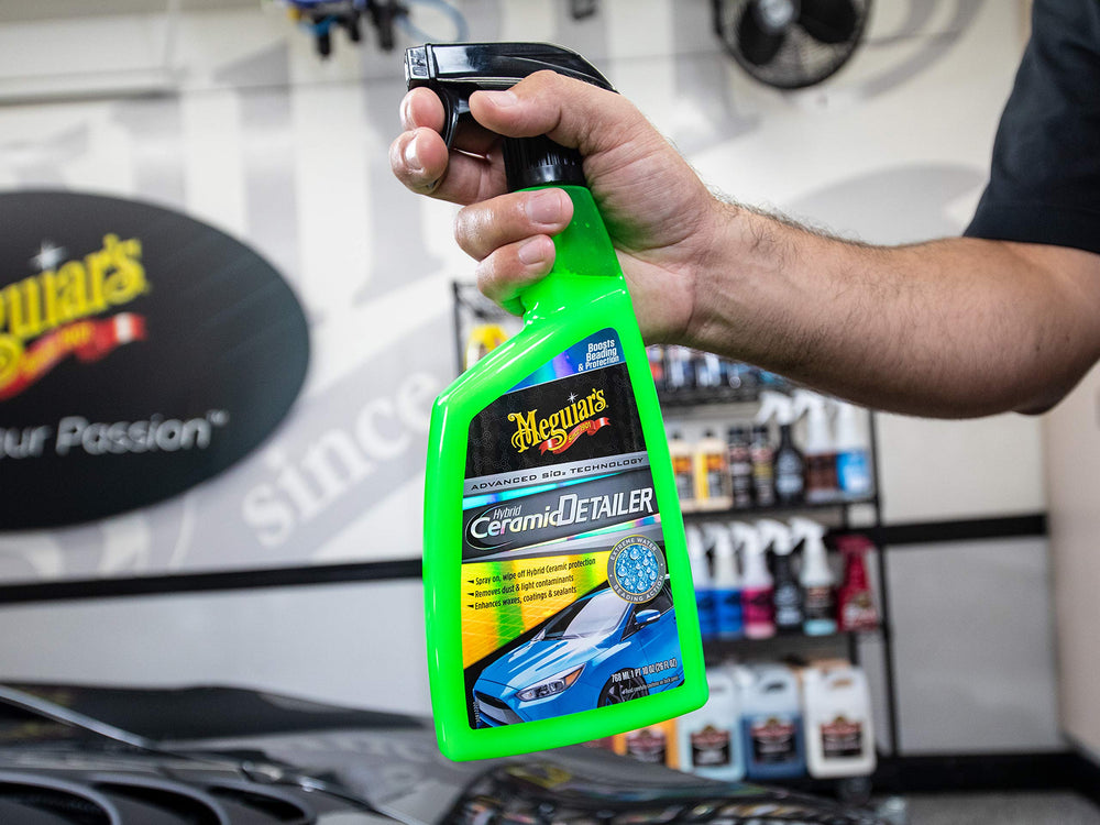 Meguiar's Hybrid Ceramic Detailer spray-on action removing light dust.