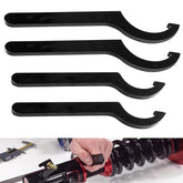 Mekar coilover adjustment tool with two large wrenches ready for quick suspension tweaks