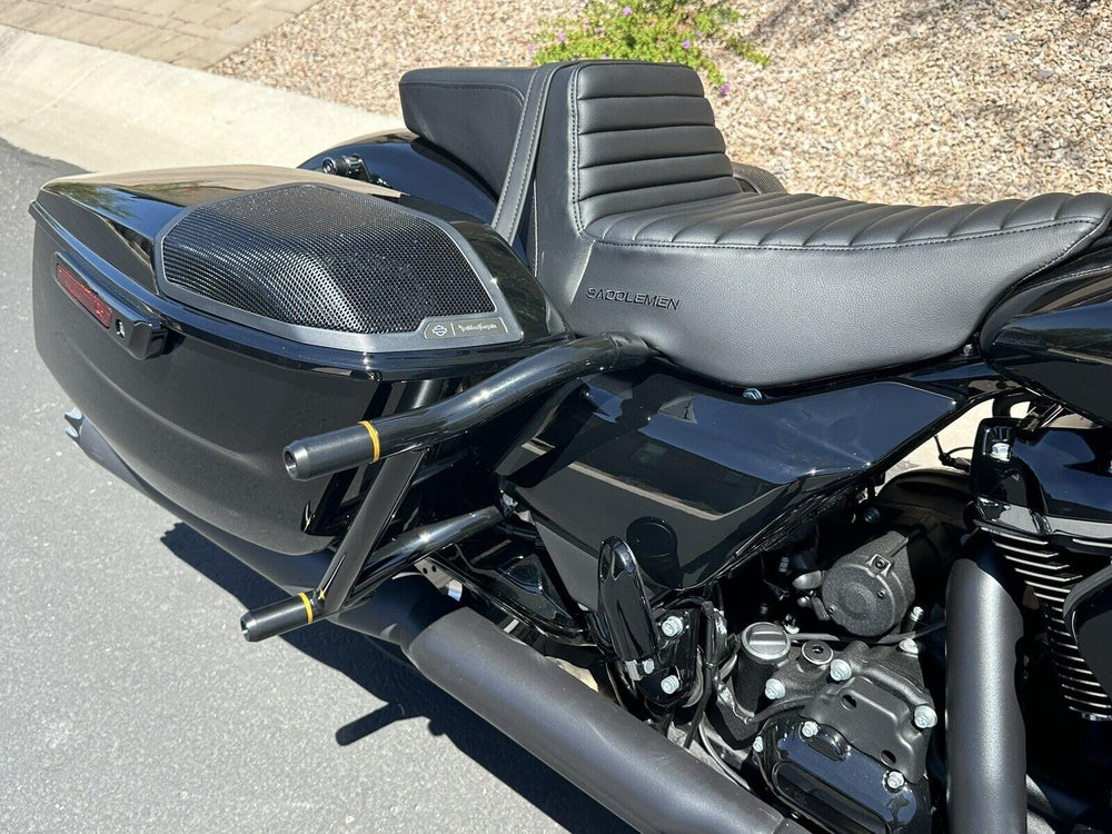 M Maintenanse saddlebag guards installed on Harley Touring bike for protection.