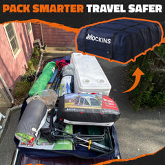 Loading suitcases into Mockins navy rooftop bag during travel.