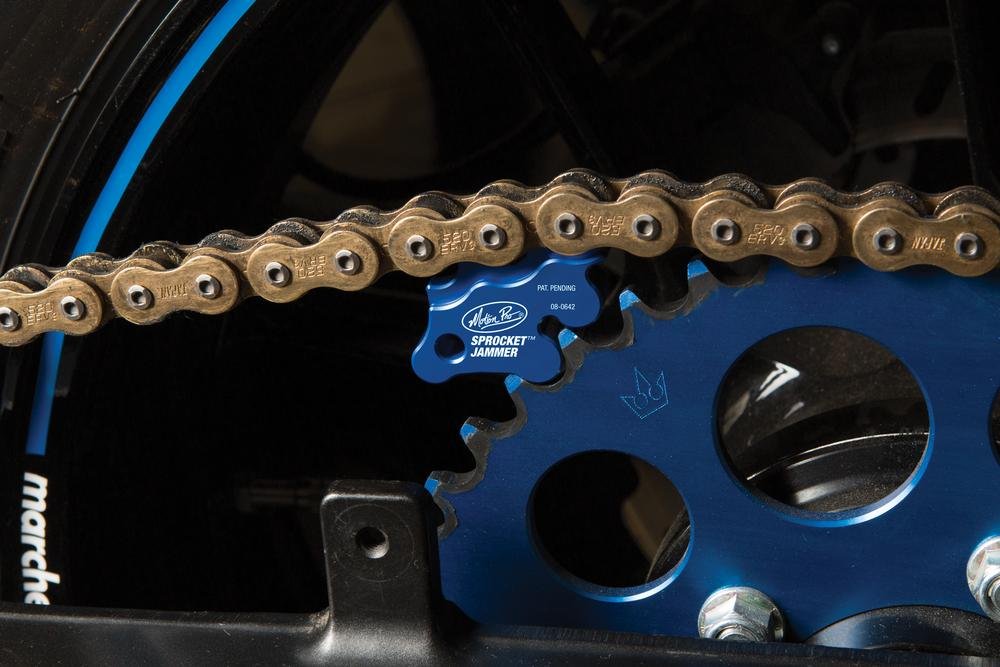 Motion Pro Sprocket Jammer blue in use stabilizes sprockets during repairs