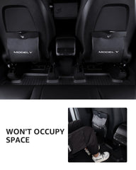 Motrobe Model Y seat-back installation with buckles for secure bag placement.