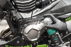Muc-Off Protectant spray being applied to a surface to protect bike finish