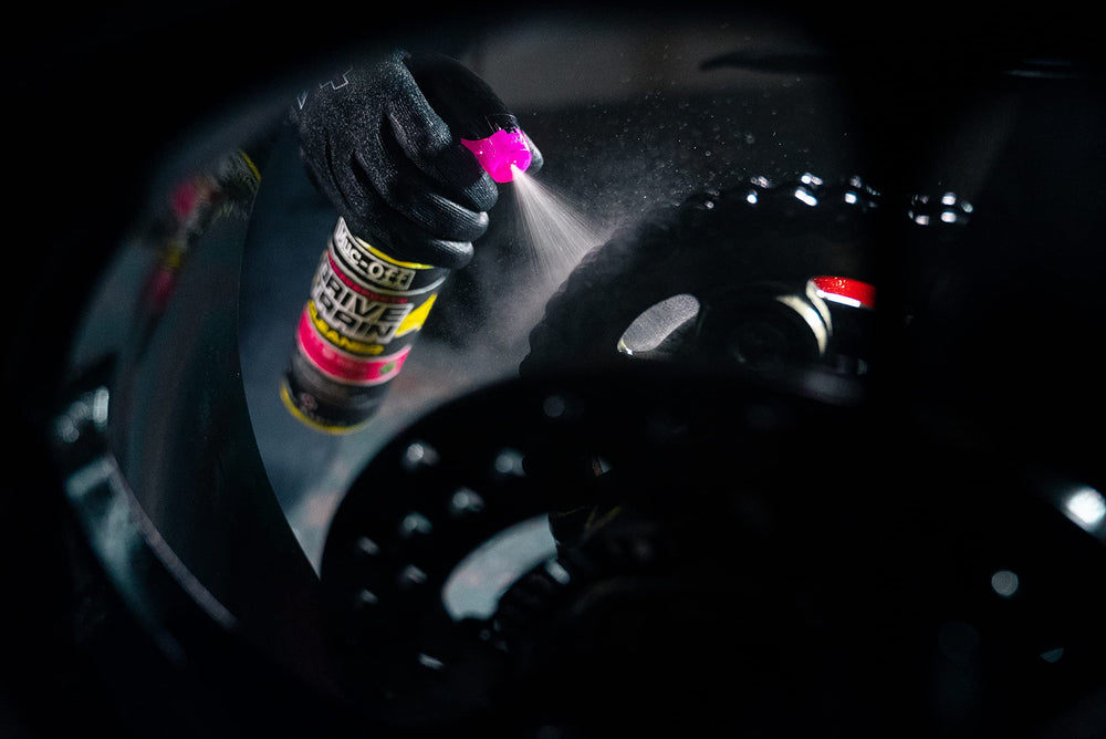 Muc-Off Powersports Drivetrain Cleaner on a chain area during cleaning