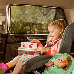 Brica sun shade shows five magnets securing to metal door frames.