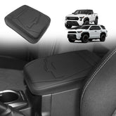 Muslogy center console armrest cover on Toyota Tacoma protects upholstery while driving.