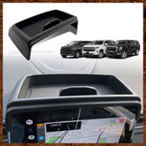 Muslogy dashboard storage box behind screen for Yukon and Tahoe keeps items organized.