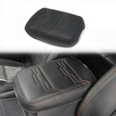 Muslogy Nissan Frontier center console cover with orange trim protects the console from wear.