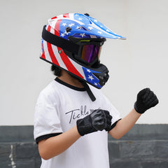 MXJ Gear youth dirt bike helmet in action on off-road trail.