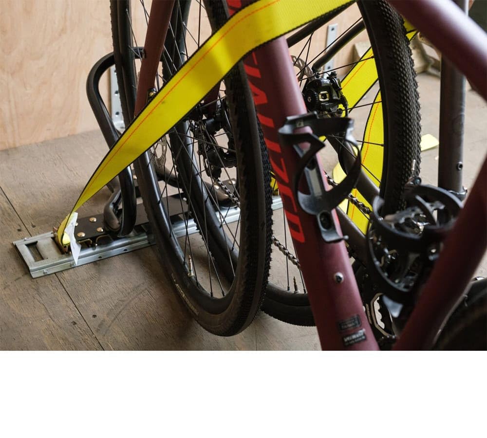 Installation diagram showing Mytee wheel chock mounting into E-Track system.