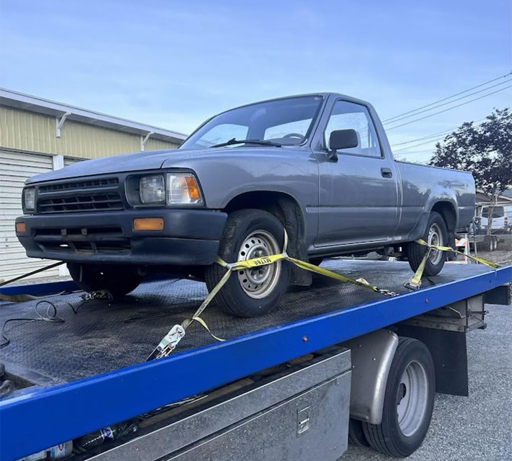 Mytee Roll Back Tie-Down System in use on a car hauler