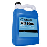 Nanoskin Wet Look Tire Dressing bottle applying bold gloss to exterior tires