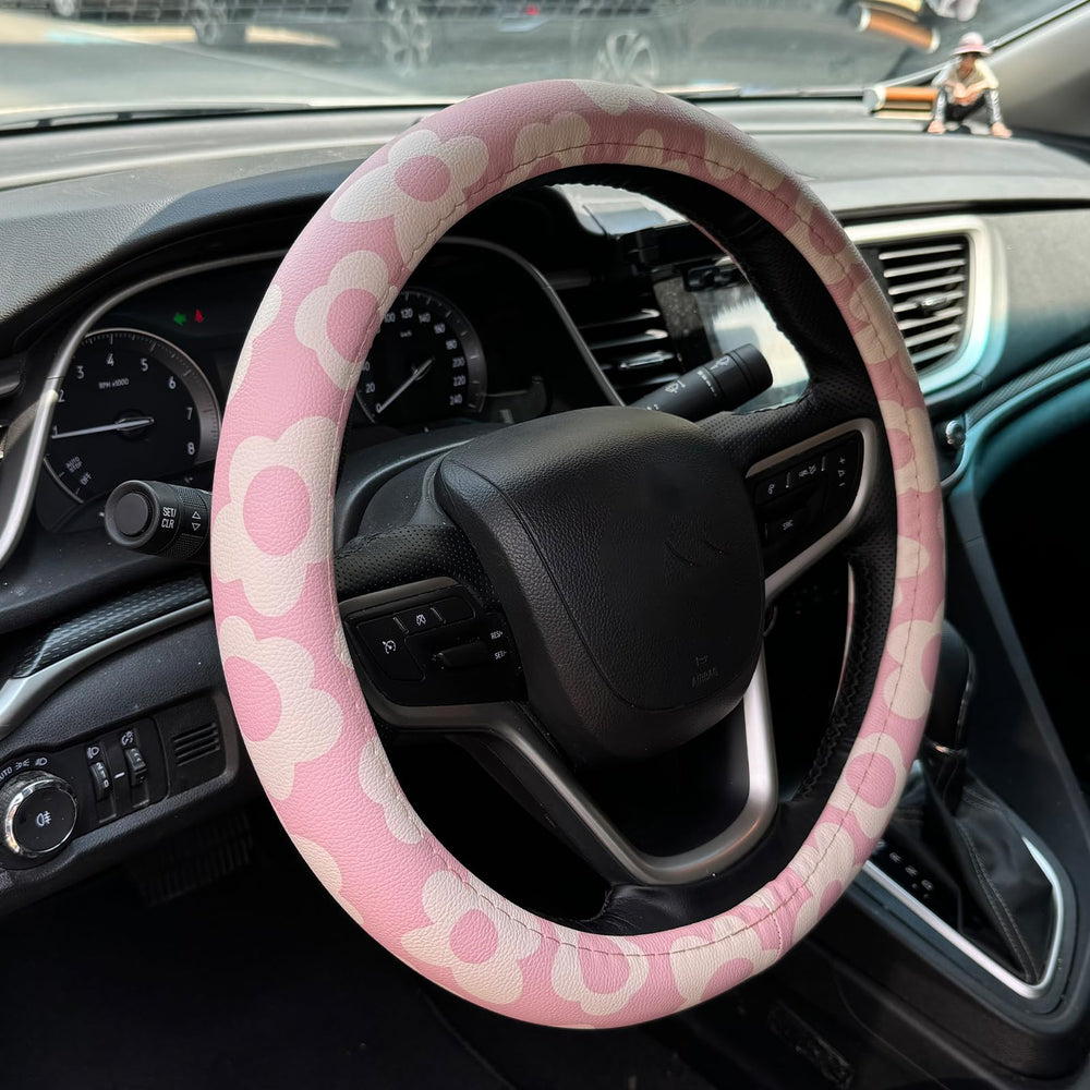 Naxizo Vintage Groovy Flowers pink steering wheel cover improves grip and style.