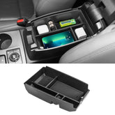 Neepiar center-console-tray close-up showing charging hole for devices