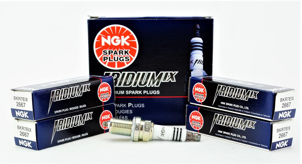 NGK Iridium IX spark plug close-up showing precise 0.6 mm electrode for faster starts
