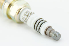 NGK Iridium IX spark plug packaging showing pack of 4 for engine maintenance